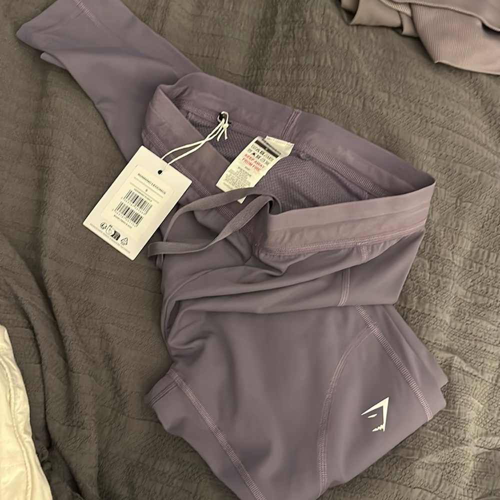 2 pairs of running leggings and crop tank. All together. Never worn.